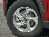 Command attention with the 2023 Hyundai Tucson Preferred, a crimson red SUV that seamlessly blends s... (image 5)