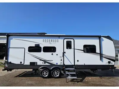 New floor plan. Beautiful couples trailer with king bed, lots of bedroom storage, breakfast bar with...