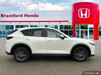 Experience the smooth handling and confident all-wheel drive of this 2021 Mazda CX-5 CX5TRXA. With o... (image 6)