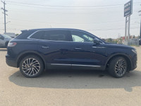 Under the glistening Rhapsody Blue exterior, the 2019 Lincoln Nautilus Reserve stands as a testament... (image 8)