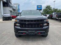 The 2022 Chevrolet Silverado 1500 LTD Custom Trail Boss in an adventurous black finish, powers throu... (image 8)