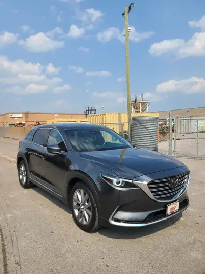 This 2022 Mazda CX-9 Grand Touring AWD is a sleek and spacious SUV that's perfect for your family ad...