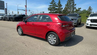 This Kia Rio is equipped with: Cloth, 6 Speakers, Cloth Seat Trim, Heated front seats, Radio: AM/FM/... (image 2)