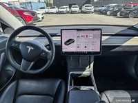 This Tesla Model 3 delivers a Electric engine powering this Automatic transmission. Window Grid Ante... (image 9)
