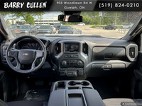 The 2025 Chevrolet Silverado 2500HD Custom in pristine white with a robust 44 drivetrain is designed... (image 7)