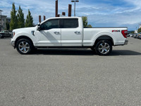This 2021 Ford F-150 LARIAT has a Star White Exterior and Black Leather Interior with seating for 5.... (image 1)