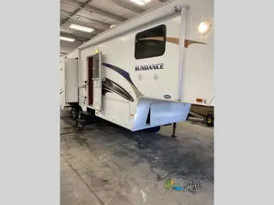 Triple Slide Sundance FW w/Rear Living Area Including 2 Rockers w/Overhead Storage, & Sofa & Booth D...