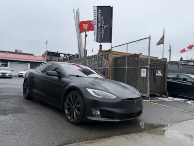 This sleek 2018 Tesla Model S in black is a stylish and eco-friendly choice for your next ride. With...