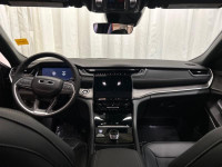 The 2025 Jeep Grand Cherokee L Limited 4x4 in sophisticated gray with its smooth 4x4 drivetrain prom... (image 8)