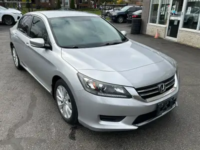 Silver on grey cloth interior with heater seats, Bluetooth mobile connection, cruise control, backup...