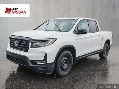 Experience truck versatility with SUV comfort in this 2021 Honda Ridgeline, a unique and capable pic...