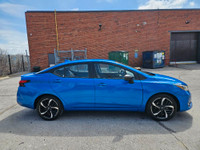 Buckle up, because this 2023 Nissan Versa SR CVT in Electric Blue Metallic isnt just a carits your t... (image 7)