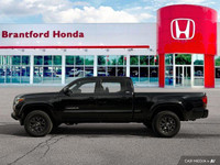 Conquer any terrain with this 2020 Toyota Tacoma Crew Cab Pickup, boasting a rugged Magnetic Grey Me... (image 1)