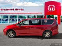 Command attention with this 2024 Chrysler Pacifica Touring-L, boasting a stunning Red Hot Pearl Coat... (image 1)