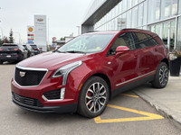 Stand out in Radiant Red Tintcoat with this premium 2023 Cadillac XT5 Sport AWD, blending luxury, pe... (image 1)