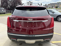 The 2017 Cadillac XT5 Platinum in Red Passion Tintcoat delivers all-wheel drive performance powered... (image 6)