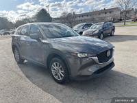WAS: $35879 NOW: $29998 plus taxes and licensing feesExplore the 2023 Mazda CX-5 GX: A Perfect Blend... (image 5)