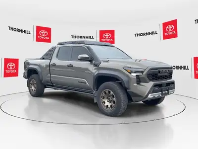 This, is a Bronze 2024 Toyota Tacoma Hybrid Double Cab with TRAILHUNTER Package, Featuring:~ No Acci...