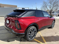 Finished in a head-turning Radiant Red Tricoat with a sleek Noir interior, the 2025 Cadillac Optiq E... (image 8)