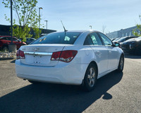 KBB.com 10 Best Sedans Under $25,000. This Chevrolet Cruze boasts a Turbocharged Gas I4 1.4L/83 engi... (image 4)