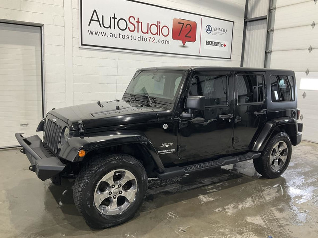 2016 Jeep Wrangler Unlimited Modèle Sahara 4 portes traction int in Cars & Trucks in Laval / North Shore