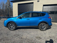 The 2017 Toyota RAV4 Hybrid XLE in a stunning blue finish offers exceptional control with its AWD dr... (image 1)