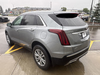 The 2023 Cadillac XT5, finished in a sleek Argent Silver Metallic paint, offers a confident all-whee... (image 5)
