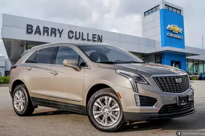 The 2023 Cadillac XT5 FWD Luxury in an elegant tan hue with its nimble front-wheel drive is all abou...