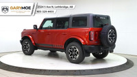 Experience the power and style of the red 2023 Ford Bronco Outer Banks 4 Door Advanced 4x4, boasting... (image 2)