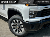The 2025 Chevrolet Silverado 2500HD Custom in pristine white with a robust 44 drivetrain is designed... (image 1)