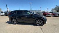 This Honda CR-V is equipped with: Leatherette/Fabric Seating Surfaces, Power moonroof, Heated front... (image 9)
