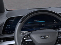 Finished in a head-turning Radiant Red Tricoat with a sleek Noir interior, the 2025 Cadillac Optiq E... (image 6)
