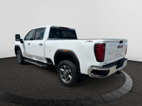 This 2025 GMC Sierra 2500HD in Summit White is equipped with 4WD and Turbocharged Diesel V8 6.6L/ en... (image 2)