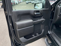 The 2022 Chevrolet Silverado 1500 LTD Custom Trail Boss in an adventurous black finish, powers throu... (image 9)
