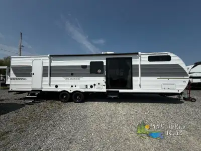Forest River Wildwood travel trailer 36VBDS highlights: Rear Private Bedroom Walk-Through Bath Firep...