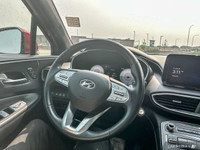 The 2021 Hyundai Santa Fe in Flame Red with Obsidian Black Nappa leather offers a panoramic sunroof,... (image 9)