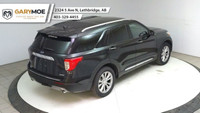 The 2024 Ford Explorer Limited 4WD in sleek black is a robust yet stylish SUV designed to conquer bo... (image 9)