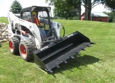 Attaches to skid steer universal hitch to tilt 18 degrees left and right. Tilts buckets and landscap...