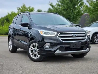 Step into the 2017 Ford Escape SE, a black, front-wheel drive SUV that delivers consistent handling...