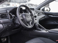 WAS: $34250 NOW: $32750 plus taxes and licensing feesThe 2023 Toyota Camry Hybrid in Super White is... (image 5)