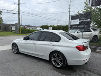 This 2014 BMW 320 is a sleek and reliable sedan that's sure to turn heads. With its stylish white ex... (image 2)