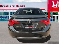 This 2017 Toyota Corolla SE boasts a sleek Slate Metallic exterior and a comfortable BLACK SOFTEX LE... (image 4)