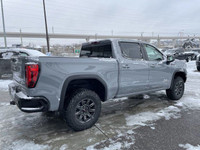 The 2025 GMC Sierra 1500 AT4X in Thunderstorm Grey Metallic is a formidable off-road truck that seam... (image 7)