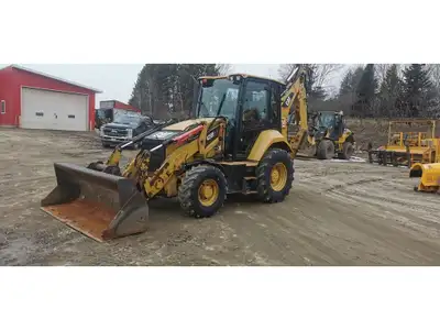 4,561 hours, ''tool carrier'', enclosed cab, 93'' Cat bucket, hydraulic quick connect, front and rea...