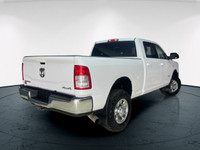 The 2020 Ram 2500 Big Horn in a classic white exterior and rugged 4x4 drivetrain promises unparallel... (image 1)