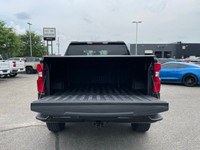 The 2022 Chevrolet Silverado 1500 LTD Custom Trail Boss in an adventurous black finish, powers throu... (image 4)