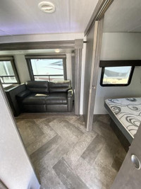 East to West Alta with bunkroom! This trailer features 2 slides, one in the main living area and ano... (image 2)