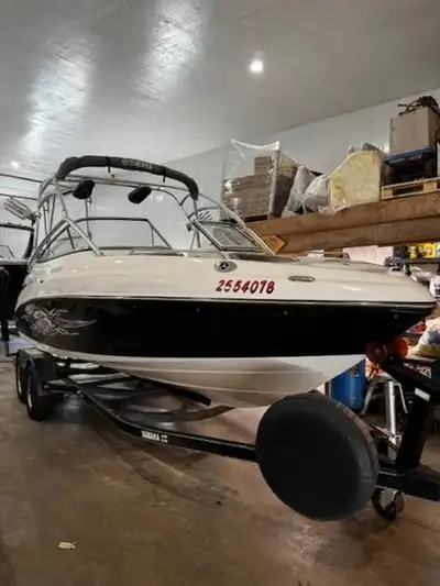 The Yamaha AR230 is a 23-foot runabout boat designed for families and watersports, particularly wake...