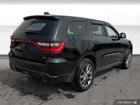 The 2018 Dodge Durango offers leather-faced bucket seats, heated front and rear seats, a heated stee... (image 5)