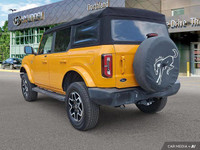 Turn heads and conquer any terrain in this vibrant 2021 Ford Bronco! This eye-catching yellow conver... (image 2)